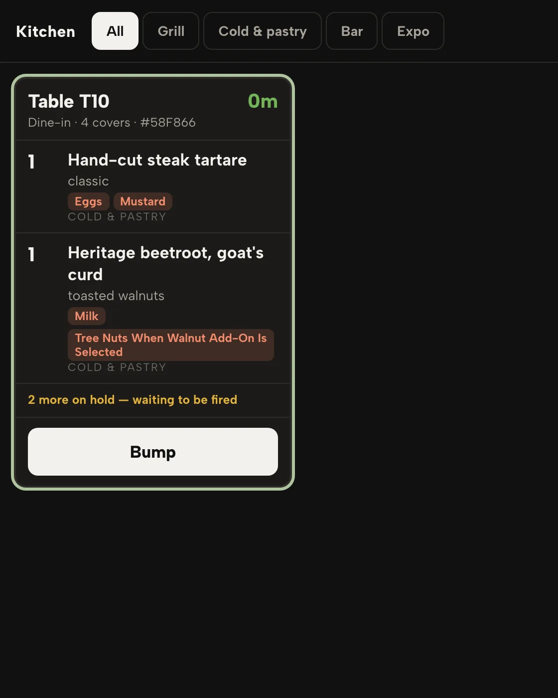 The TableSpark kitchen display with a table ticket and a course held back
