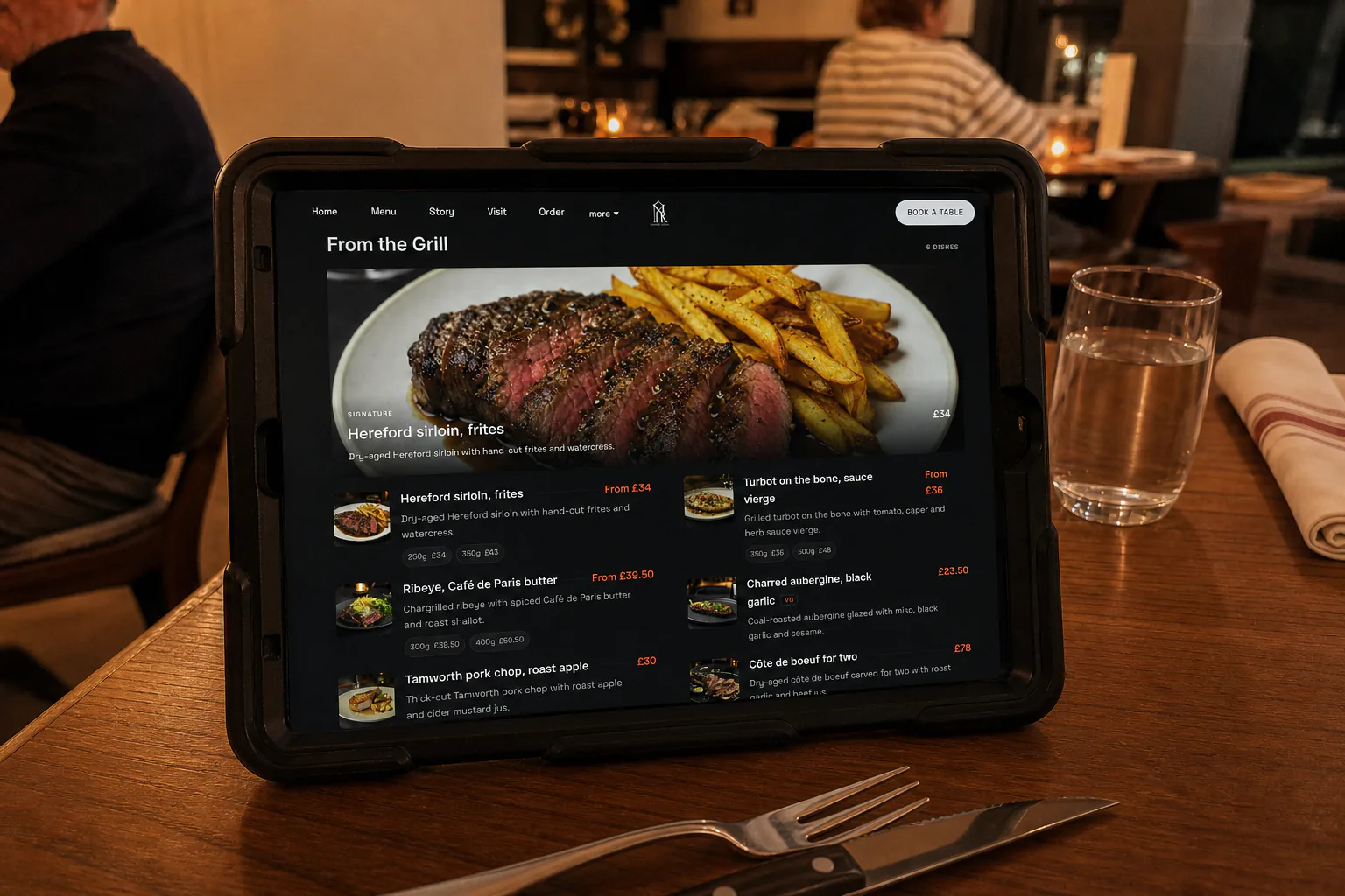 An iPad showing a TableSpark restaurant menu on a dining table