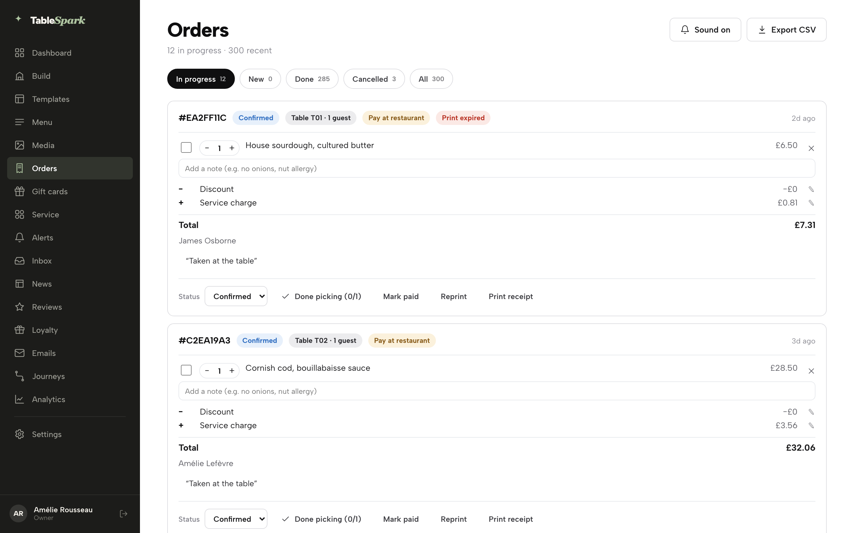 The Orders screen, In progress tab: two confirmed dine-in tickets each carrying a Pay at restaurant chip and a Mark paid button